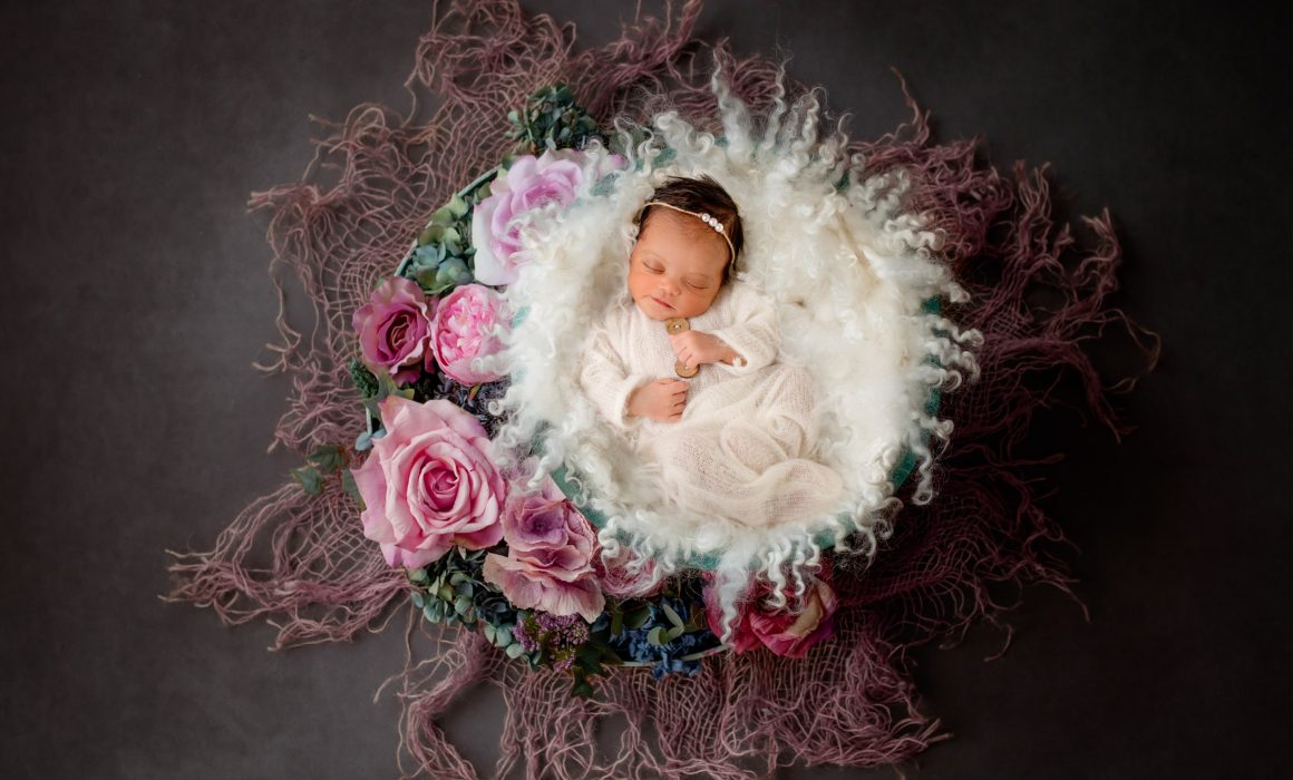 newborn baby artwork photo in a basket