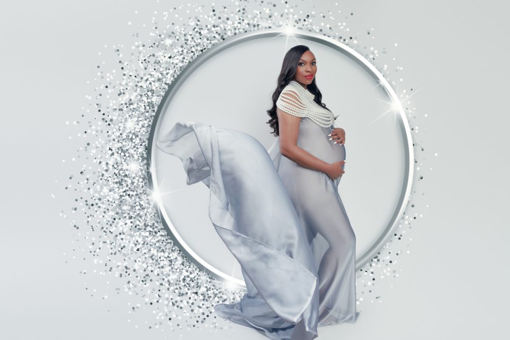 maternity photo of a woman in silver dress