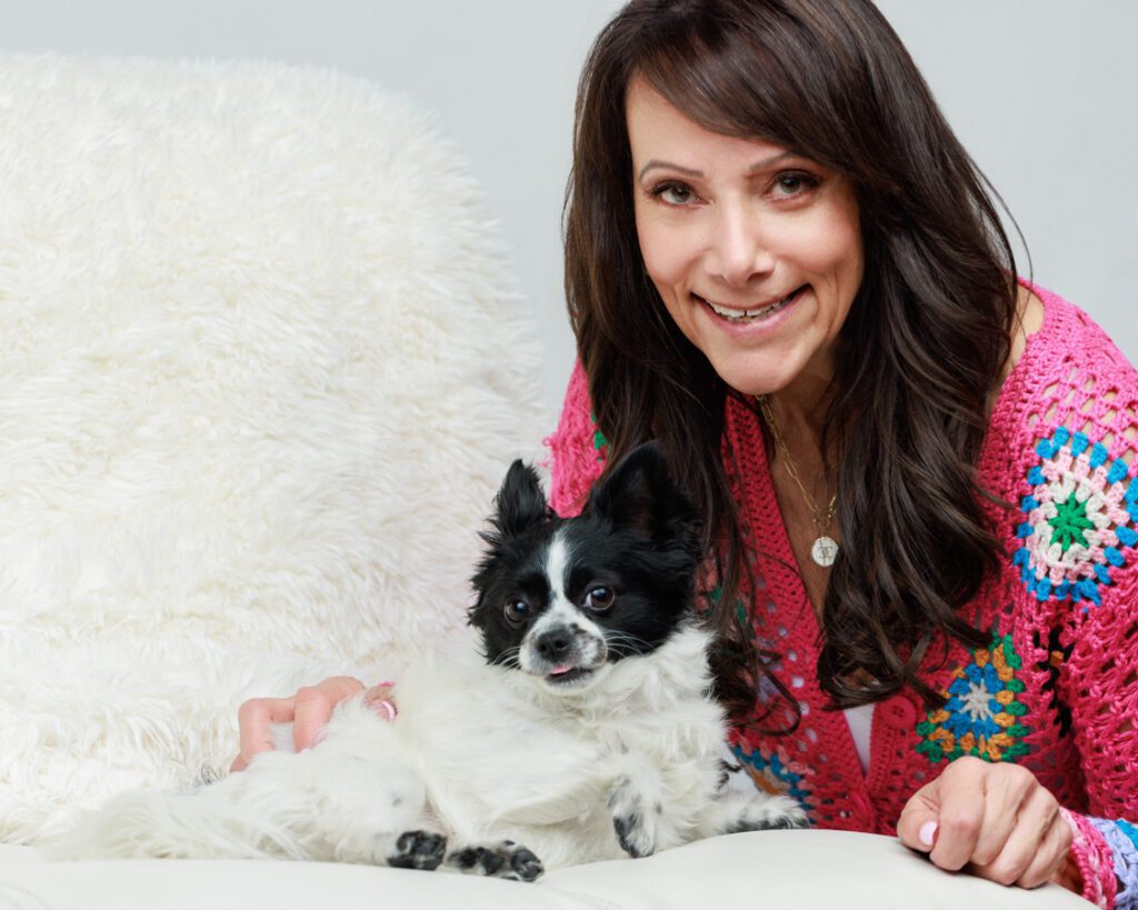 woman holding a small dog professional photo pooja photography