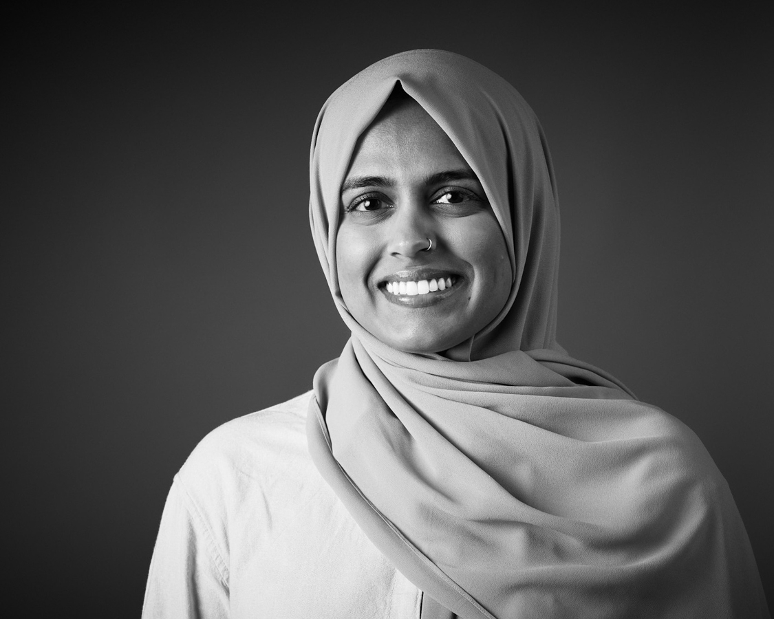 Black and white editorial portrait of an Adobe employee at the headshot booth in San Jose